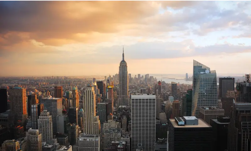 City skyline view from top of Empire State Building, showcasing sustainable real estate development and sustainability strategy.